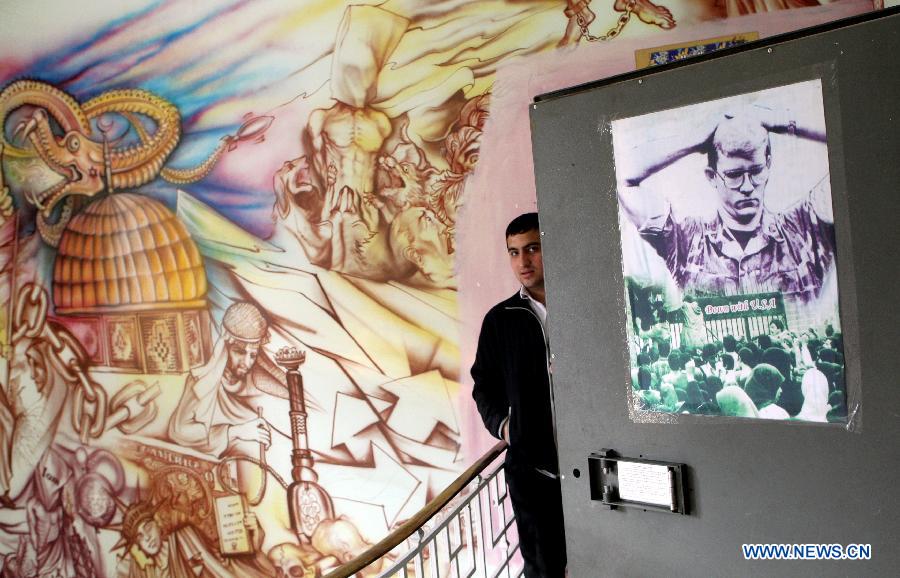 An Iranian staff member stands inside the former U.S. embassy in downtown Tehran, Iran, March 10, 2013. The United States broke off diplomatic relations with Iran on April 7, 1980 after a group of Iranian students seized the U.S. embassy in Tehran and captured some 60 U.S. diplomats in 1979, with 52 of them being in captivity for 444 days in the hostage crisis. (Xinhua/Ahmad Halabisaz)