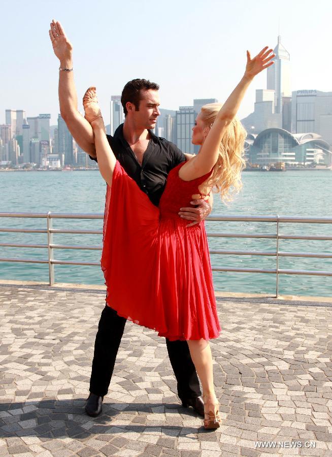 The actors of music drama "Dirty Dancing" perform during a promotion campaign at Tsim Sha Tsui in Hong Kong, south China, March 10, 2013. The music drama would be shown in Hong Kong since April 19. (Xinhua/Jin Yi)