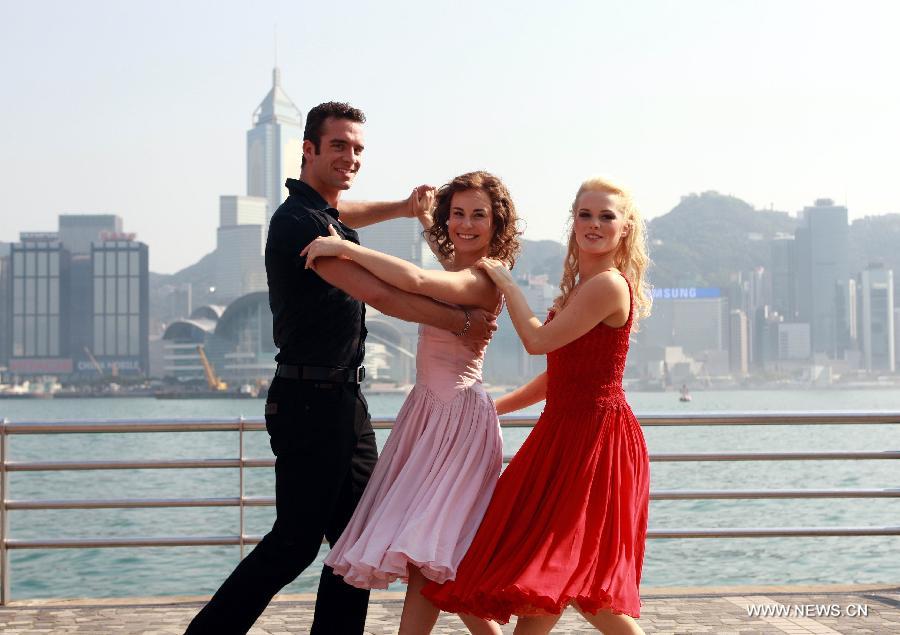 The actors of music drama "Dirty Dancing" perform during a promotion campaign at Tsim Sha Tsui in Hong Kong, south China, March 10, 2013. The music drama would be shown in Hong Kong since April 19. (Xinhua/Jin Yi)