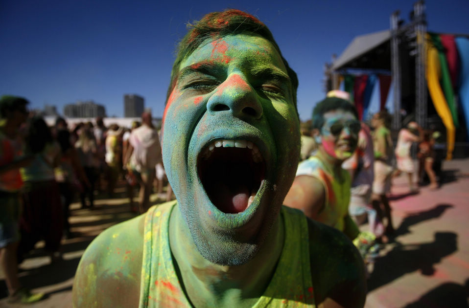 Revellers react as they are covered in colored cornflour while participating in the 'Holi One' festival in Cape Town, March 2, 2013. The event is inspired by the Holi festival which originated in India. (Xinhua News Agency/Reuter)