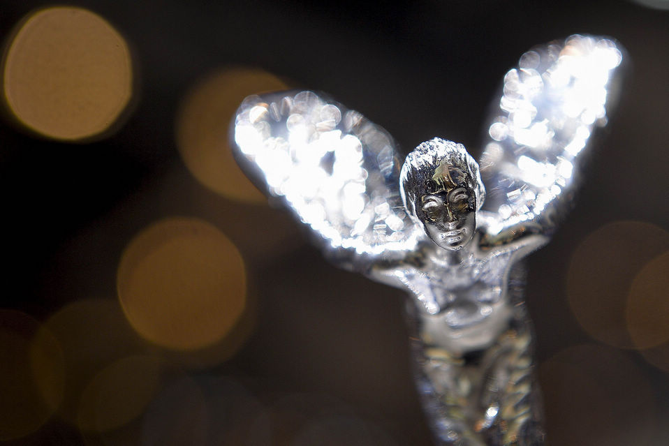 The Rolls-Royce's iconic mascot "the Spirit of Ecstacy" is pictured on the bonnet of the new Rolls Royce Wraith model car displayed as World premiere at the British carmaker's booth on the press day of Geneva car Show, in Geneva on March 7, 2013. Held annually with more than 130 product premiers from the auto industry, the Geneva Motor Show is one of the world抯 five most important auto shows. (Xinhua News Agency/AFP)