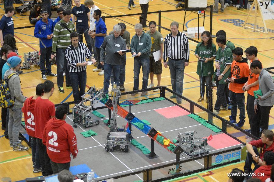 Students from over 96 high-schools across North America compete in 2013 VEX Robotics Competition at British Columbia Institute of Technology (BCIT) in Burnaby, BC, Canada on March 9, 2013. Using VEX Robotics Design System, competing teams, with guidance from their teachers and mentors, build the most innovative robots possible, working together to score the most points against opposing teams. This is the qualifying event for the upcoming 2013 VEX Robotics Competition World Championship being held in Anaheim, April 17-20, 2013. (Xinhua/Sergei Bachlakov) 