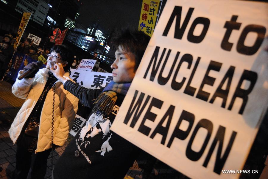 Protestors demonstrate outside the Tokyo Electric Power Company (TEPCO) in Tokyo, Japan, March 11, 2013. People demonstrated outside the TEPCO on the 2nd anniversary of 2011 earthquake, during which Fukushima nuclear plant of TEPCO had a nuclear accident. They asked for compensation to Fukushima residents and protested against the reopen of nuclear plants. (Xinhua/Kenichiro Seki)