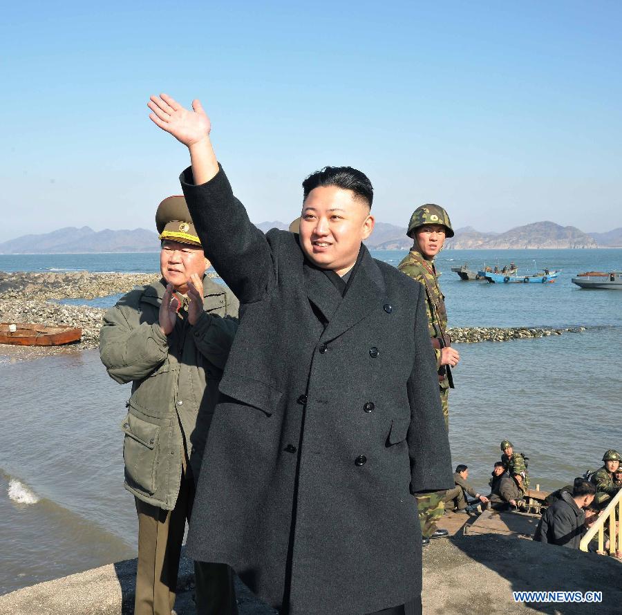 Photo released by KCNA news agency on March 12, 2013 shows Kim Jong Un, top leader of the Democratic People's Republic of Korea (DPRK), visiting the Wolnae-do Defence Detachment in the western front line, March 11, 2013. (Xinhua/KCNA)