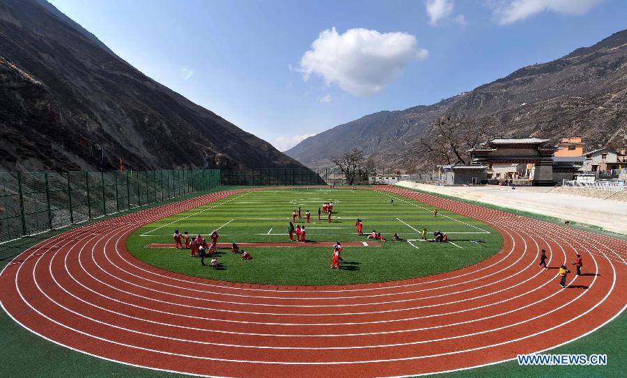 Pupils of the Tibetan ethnic group play at No. 1 Primary School of Deqin County in Diqing Tibetan Autonomous Prefecture, southwest China's Yunnan Province, March 12, 2013. A total of 1,260 pupils, most of whom are of the Tibetan ethnic group, study at this school, which was founded in September 2012. Pupils here are offered free meals and lodging. (Xinhua/Lin Yiguang) 