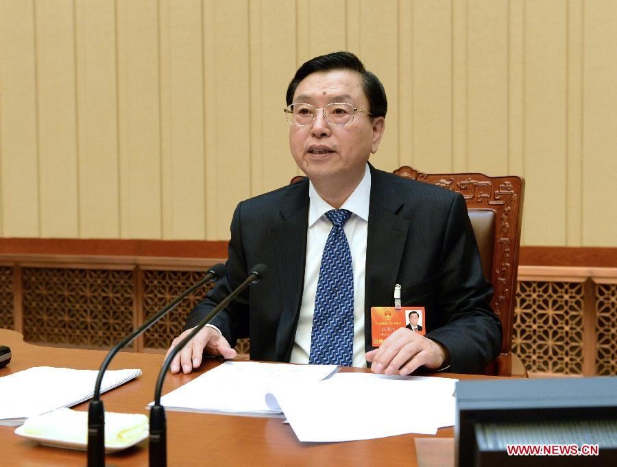 Zhang Dejiang, executive chairperson of the presidium of the first session of the 12th National People's Congress (NPC), presides over the fourth meeting of the presidium at the Great Hall of the People in Beijing, capital of China, March 13, 2013. (Xinhua/Ma Zhancheng) 
