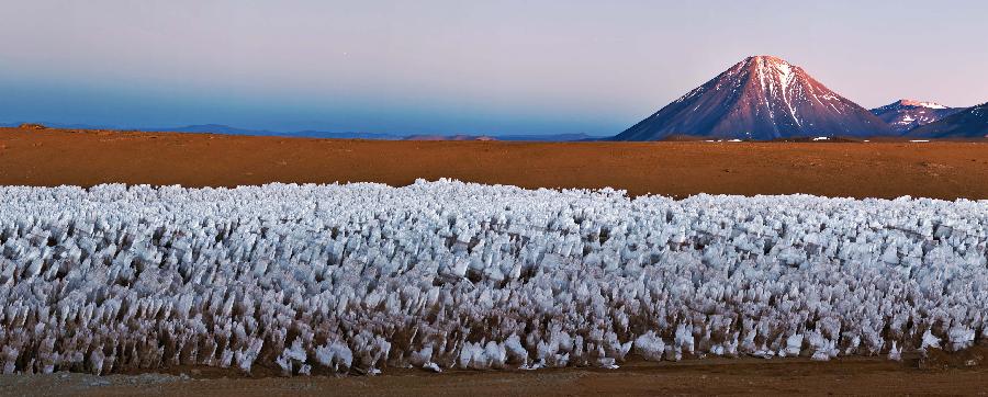 Image provided by the European Southern Observatory (ESO) on March 12, 2013, shows a panoramic view of Llano de Chajnantor which will have 66 antennas of the Atacama Large Millimetre/Submillimetre Array (ALMA) project, which aims to develop a telescope without parallel in the world. Atacama Large Millimetre/Submillimetre Array (ALMA) project is an international astronomical facility located 5,000 meters above Andes' El Llano de Chajnantor's plateau, some 50 km of San Pedro de Atacama in Chile's Second Region, in Antofagasta. The ALMA, an international partnership project between Europe, Japan and the United States, with the cooperation of Chile, is presently the largest astronomical project in the world and it will be inaugurated in Chile on March 13, 2013 to celebrate his transformation from a construction project to an observatory. (Xinhua/ESO)