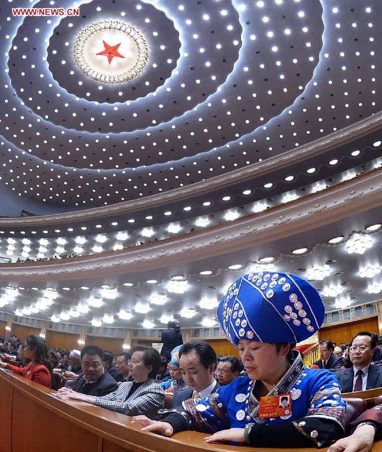 The fourth plenary meeting of the first session of the 12th National People's Congress (NPC) is held at the Great Hall of the People in Beijing, capital of China, March 14, 2013. Chairman, vice-chairpersons, secretary-general and members of the 12th NPC Standing Committee, president and vice-president of the state, and chairman of the Central Military Commission of the People's Republic of China will be elected here on Thursday. (Xinhua/Li Tao)