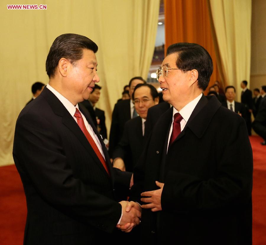 Hu Jintao (R) talks with Xi Jinping after the fourth plenary meeting of the first session of the 12th National People's Congress (NPC) in Beijing, capital of China, March 14, 2013. Xi was elected president of the People's Republic of China (PRC) and chairman of the Central Military Commission of the PRC at the NPC session here on Thursday. (Xinhua/Lan Hongguang)