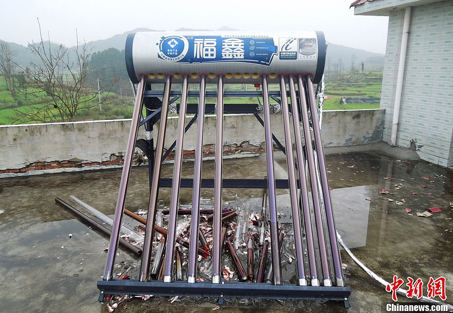 The most severe hail for centuries hits Guiding county in southwest China's Guizhou province on March 12, 2013. It has caused a direct economic loss of 14.73 million yuan. The strong hail lasted for about 30 minutes. The hailstones measured between 3 and 4 centimeters in diameter, with the biggest ones being 7 centimeters. Five villages were affected, with houses, crops, living facilities, forests damaged in varying degrees. (Chinanews/Chen Guangfei)