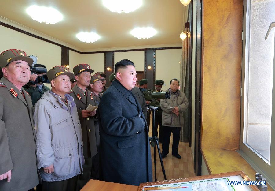 The undated photo provided by Korean Central News Agency (KCNA) on March 14, 2013 shows Kim Jong Un, top leader of the Democratic People's Republic of Korea (DPRK), watching a live shell firing drill at the southwest sector of the front line. Kim Jong Un watched and guided the drill which was conducted by the Jangjae Islet defense detachment and the Mu Islet artillery detachment. (Xinhua/KCNA)  