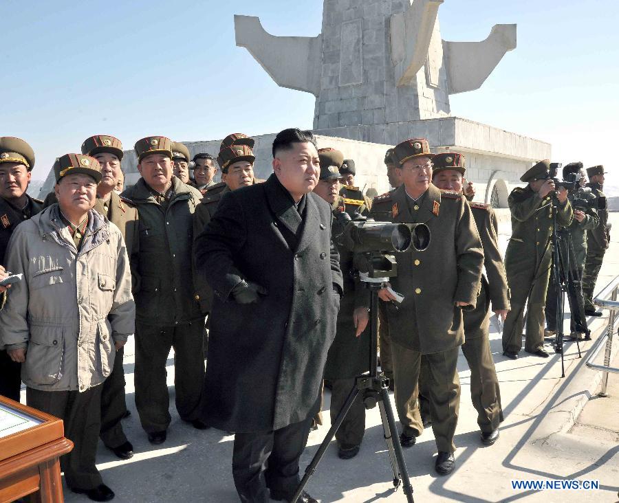 The undated photo provided by Korean Central News Agency (KCNA) on March 14, 2013 shows Kim Jong Un, top leader of the Democratic People's Republic of Korea (DPRK), watching a live shell firing drill at the southwest sector of the front line. Kim Jong Un watched and guided the drill which was conducted by the Jangjae Islet defense detachment and the Mu Islet artillery detachment. (Xinhua/KCNA)  