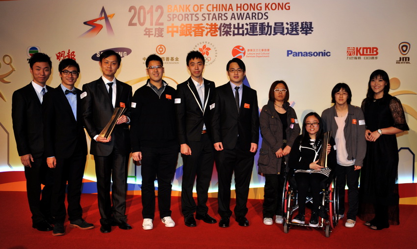 "Hong Kong Sports Stars Awards for Team Event" winners Women's Wheelchair Fencing Team (R) and 22nd Asian Tenpin Bowling Championships Team of Five take a group photo on the podium at the Hong Kong Convention and Exhibition Centre on March 14, 2013. (Xinhua/Lu Binghui)