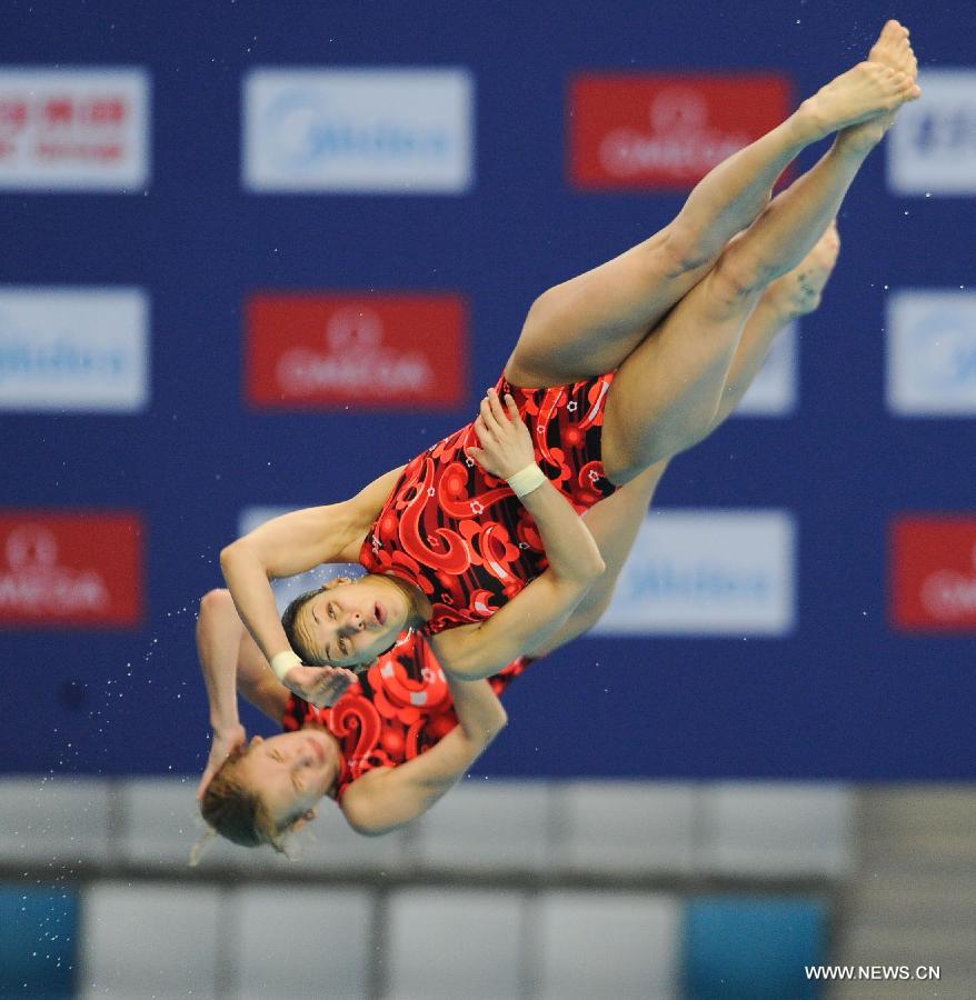 Yulia Koltunova and Natalia Goncharova of Russia compete during the women's 10m Platform Synchro Final in the FINA Diving World Series 2013-Beijing at the National Aquatics Center in Beijing, China, Match 15, 2013. Yulia Koltunova and Natalia Goncharova won the bronze medal with 316.56 points. (Xinhua/Jia Yuchen)