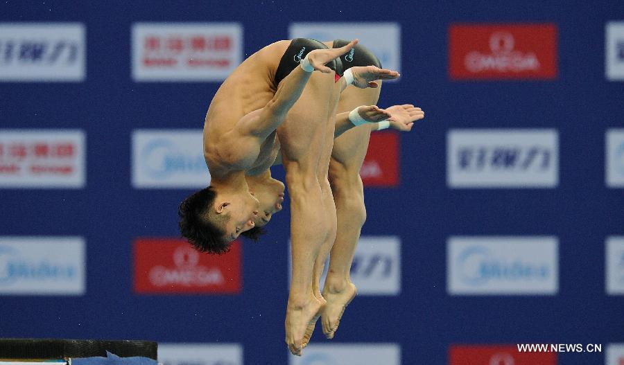 Lin Yue and Chen Aisen of China compete during the Men's 10m Platform Synchro Final in the FINA Diving World Series 2013-Beijing at the National Aquatics Center in Beijing, China, Match 15, 2013. Lin and Chen won the gold medal with 493.47 points. (Xinhua/Cao Can)