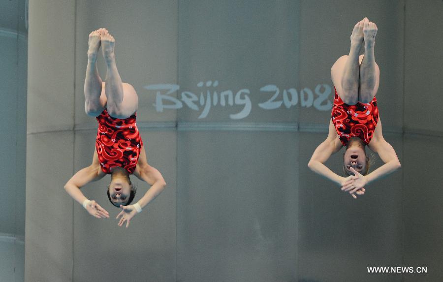 Yulia Koltunova and Natalia Goncharova of Russia compete during the Women's 10m Platform Synchro Final in the FINA Diving World Series 2011-Beijing at National Aquatics Center in Beijing, China, March 15, 2013. Yulia Koltunova and Natalia Goncharova won the bronze medal with 316.56 points. (Xinhua/Tao Xiyi)