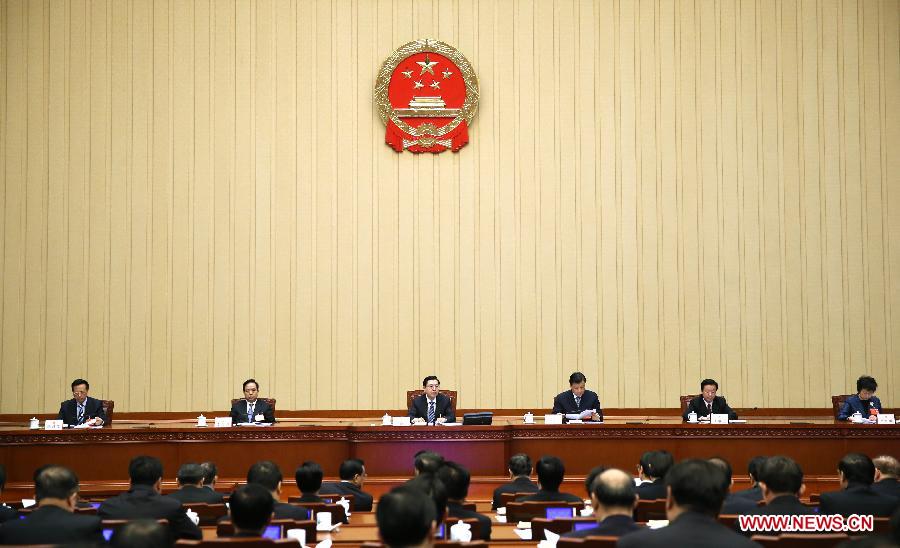 The presidium of the first session of the 12th National People's Congress (NPC) hold their seventh meeting at the Great Hall of the People in Beijing, capital of China, March 15, 2013. Zhang Dejiang, executive chairperson of the presidium, presided over the meeting on Friday. (Xinhua/Lan Hongguang)