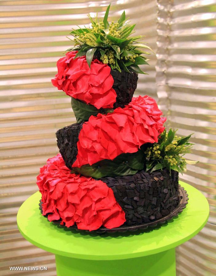 A "cake" made of plant materials is on display during the 17th Canada Blooms exhibition at the Canadian National Exhibition center in Toronto, Canada, March 15, 2013. As Canada's largest flower and garden festival, the 10-day event kicked off on Friday and was expected to attract over 200,000 visitors. (Xinhua/Ma Dan)