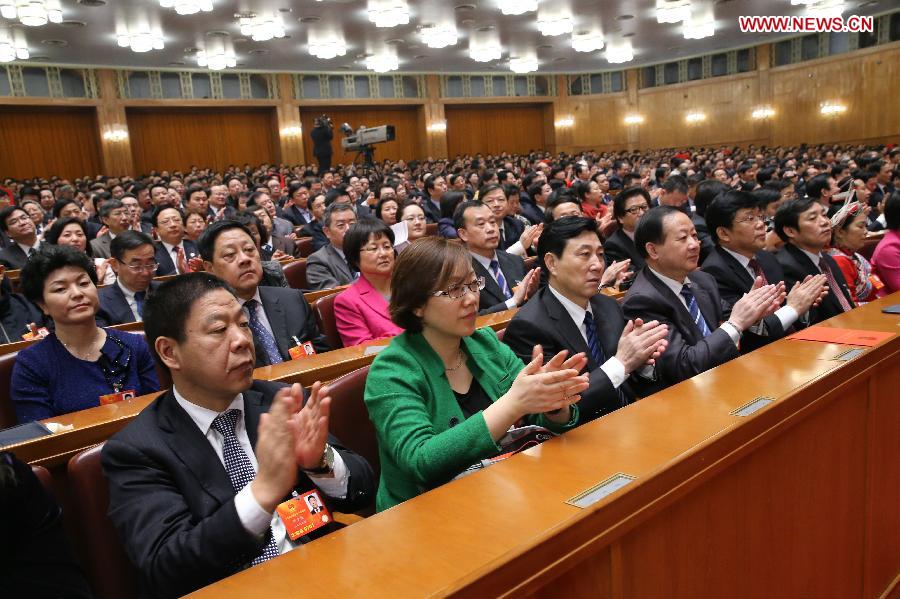 Deputies applaud during the sixth plenary meeting of the first session of the 12th National People's Congress (NPC) at the Great Hall of the People in Beijing, capital of China, March 16, 2013. (Xinhua/Liu Weibing) 