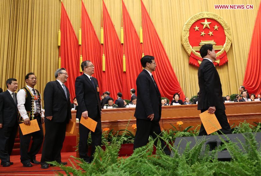 Deputies queue to cast their votes during the sixth plenary meeting of the first session of the 12th National People's Congress (NPC) at the Great Hall of the People in Beijing, capital of China, March 16, 2013. (Xinhua/Liu Weibing) 