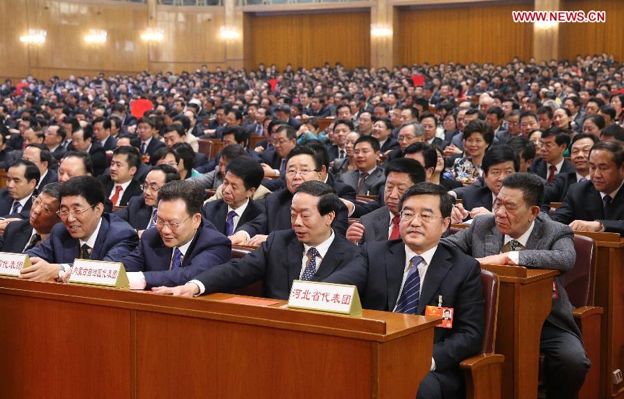 Deputies press buttons to vote during the sixth plenary meeting of the first session of the 12th National People's Congress (NPC) at the Great Hall of the People in Beijing, capital of China, March 16, 2013. (Xinhua/Liu Weibing)