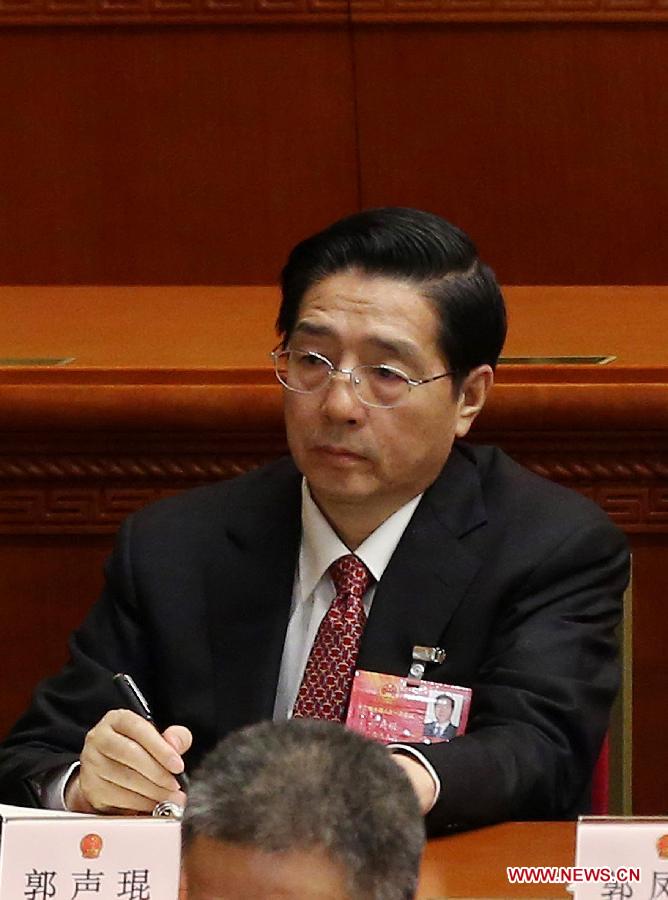 Guo Shengkun attends the sixth plenary meeting of the first session of the 12th National People's Congress (NPC) at the Great Hall of the People in Beijing, capital of China, March 16, 2013. Yang Jing, Chang Wanquan, Yang Jiechi, Guo Shengkun and Wang Yong were endorsed as state councilors of China at the meeting here on Saturday. (Xinhua/Jin Liwang)