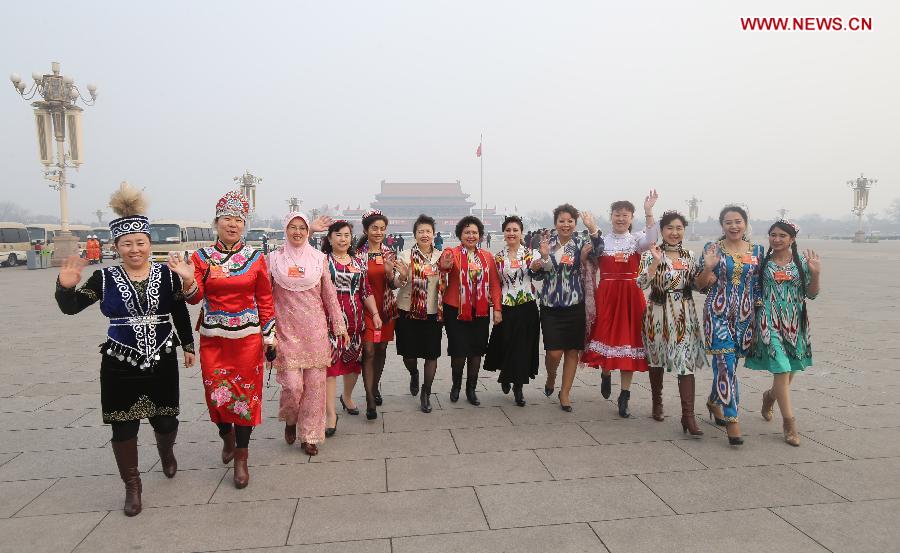 Deputies to the 12th National People's Congress (NPC) pose for a photo at the Tian'anmen Square in Beijing, capital of China, March 17, 2013. The closing meeting of the first session of the 12th NPC will be held in Beijing on Sunday. (Xinhua/Xing Guangli)