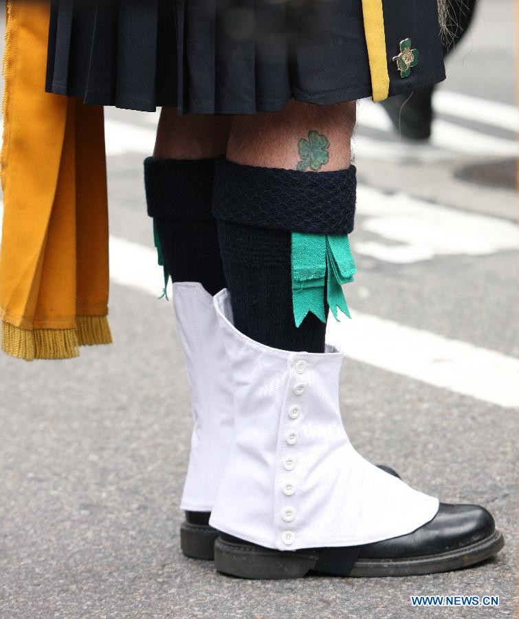 A parade participant marchs along the 5th Ave during the 252nd annual St. Patrick's Day Parade in New York City on March 16, 2013. (Xinhua/Cheng Li) 