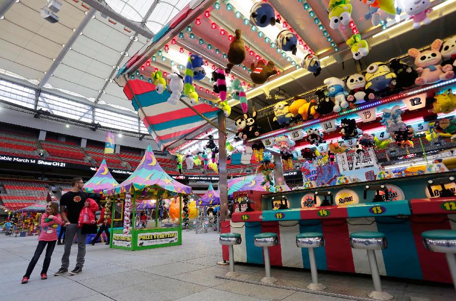 People enjoy their day at the Playdome carnival held at BC Place stadium in Vancouver, Canada. March 16, 2013. (Xinhua/Liang Sen)