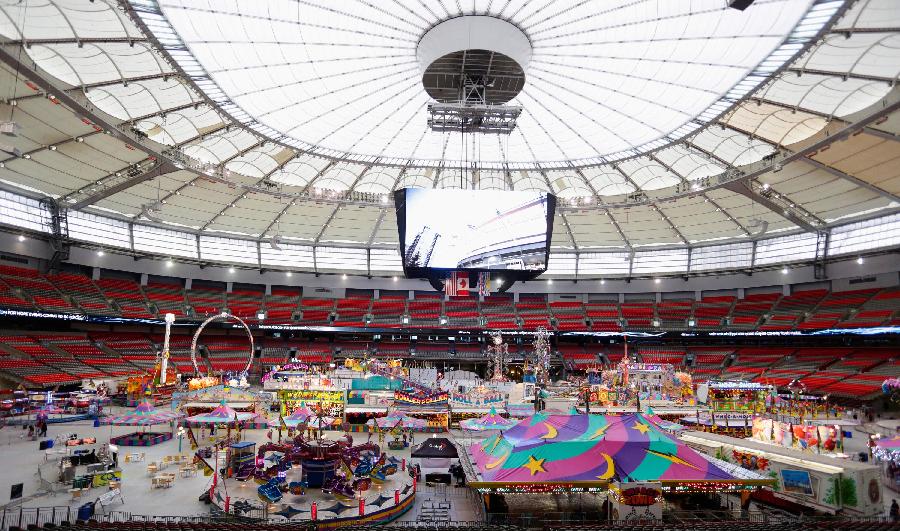 People enjoy their day at the Playdome carnival held at BC Place stadium in Vancouver, Canada. March 16, 2013. (Xinhua/Liang Sen) 