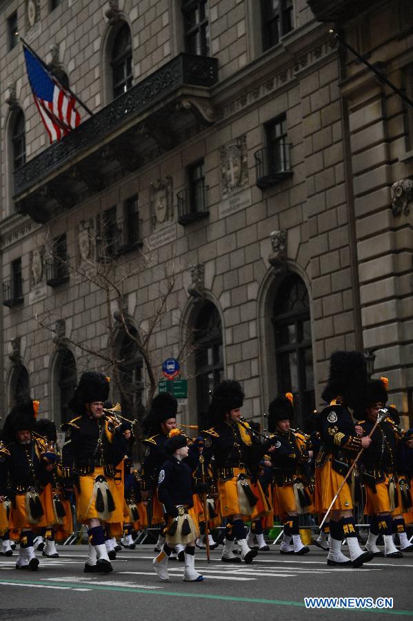 Participants of the 252nd St. Patrick's Day parade march along the Fifth Avenue in New York City, on March 16, 2013. St. Patrick's Day is widely observed in the United States as a celebration of the Irish and Irish American culture. (Xinhua/Niu Xiaolei) 