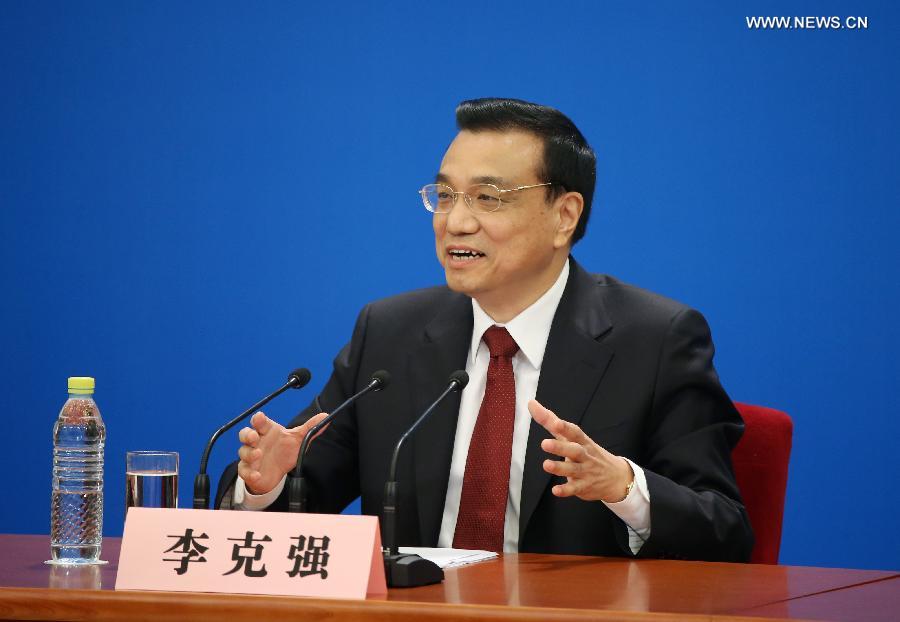 Chinese Premier Li Keqiang speaks at a press conference after the closing meeting of the first session of the 12th National People's Congress (NPC) at the Great Hall of the People in Beijing, capital of China, March 17, 2013. Chinese Premier Li Keqiang and Vice Premiers Zhang Gaoli, Liu Yandong, Wang Yang and Ma Kai met the press and answered questions here on Sunday. (Xinhua/Chen Jianli)