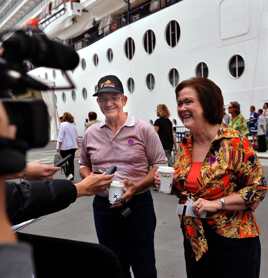 Two passengers aboard the cruise ship GTS Millennium are interviewed at the Kai Tak Cruise Terminal in south China's Hong Kong, March 16, 2013. GTS Millennium arrived at Hong Kong's Kai Tak Cruise Terminal on Saturday and became the first cruise ship to berth at the terminal prior to its official opening in June 2013. (Xinhua/Chen Xiaowei) 