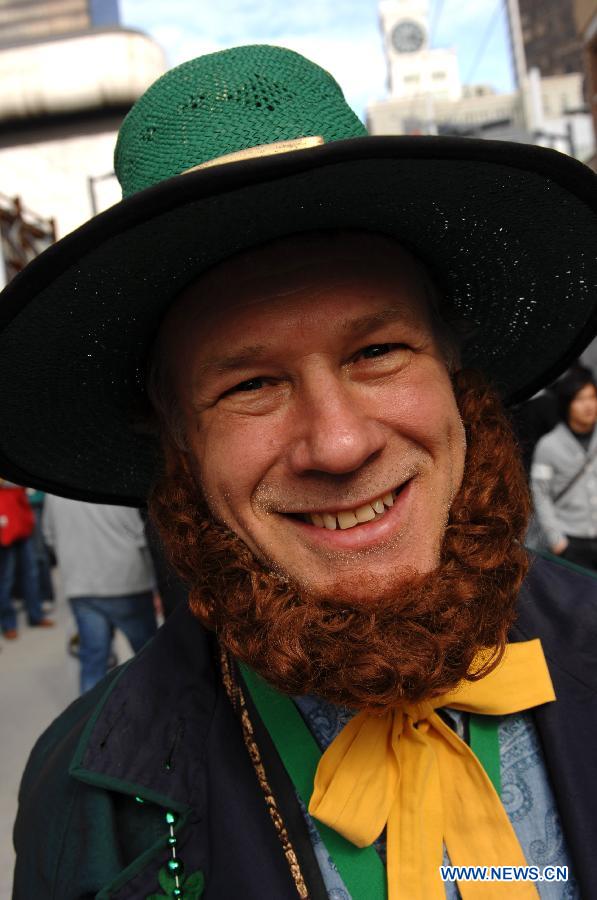 A man dressed as Leprechaun poses for the photograph during Celtic Festival, part of St. Patrick's Day celebrations, in Vancouver, Canada, March 16, 2013. More than 200,000 spectators are expected to fill the streets of Vancouver's downtown on Sunday for the annual St. Patrick's Day parade. (Xinhua/Sergei Bachlakov)