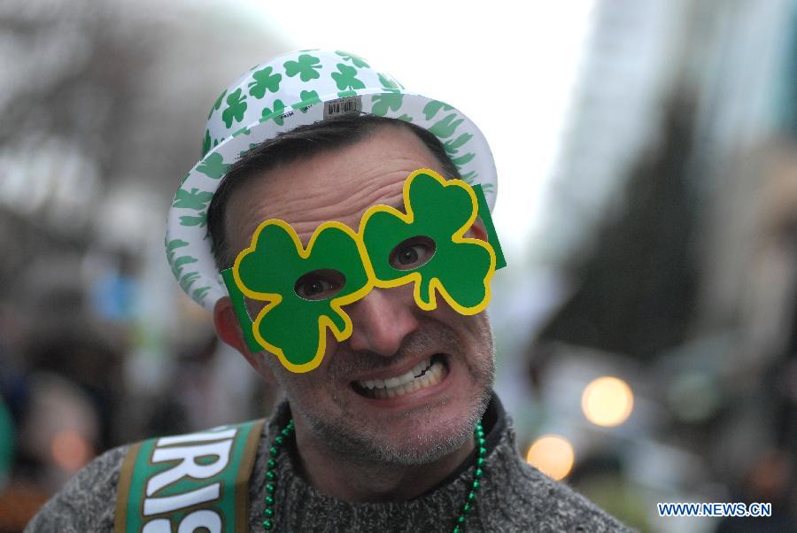 A man wearing green glasses takes part in a celebration for Celtic Festival, part of St. Patrick's Day celebrations, in Vancouver, Canada, March 16, 2013. More than 200,000 spectators are expected to fill the streets of Vancouver's downtown on Sunday for the annual St. Patrick's Day parade. (Xinhua/Sergei Bachlakov)