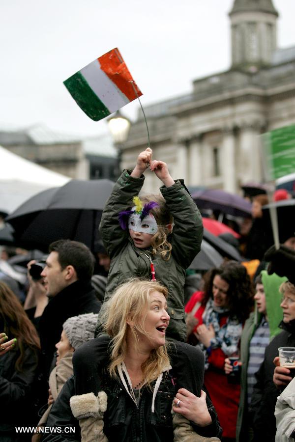 People attend the celebration of St. Patrick's Day at Trafalgar Square in London, March 17, 2013. (Xinhua/Bimal Gautam) 