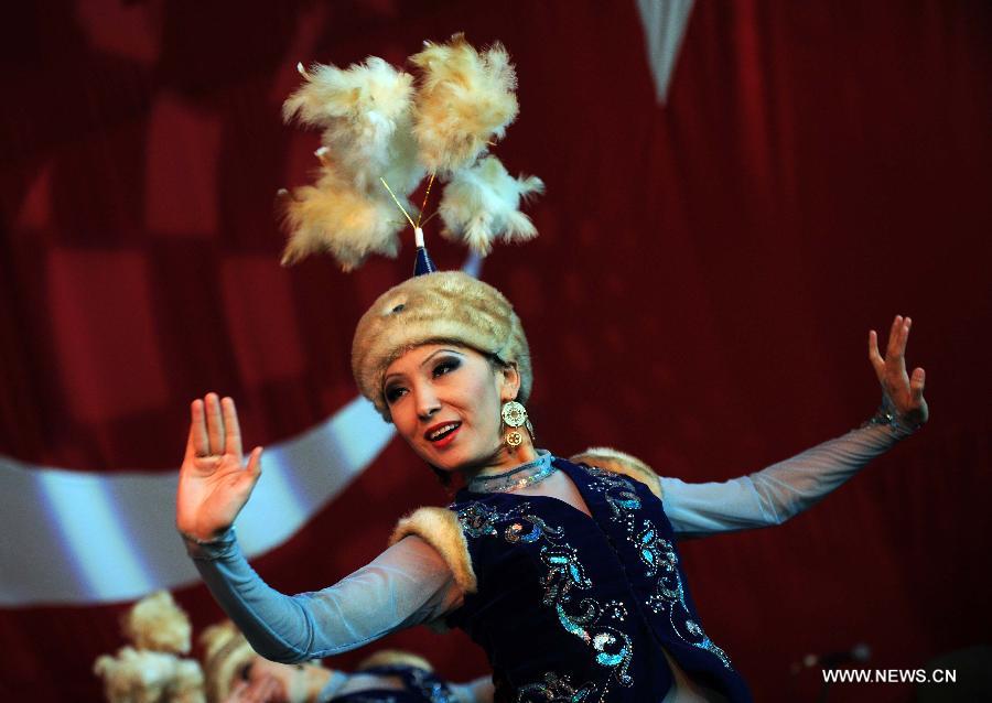 An artist performs on stage at Nevruz celebrations in Istanbul, Turkey, on March 17, 2013. The Nevruz performance, organized by the Joint Administration of Turkic Arts and Culture (TURKSOY), brings together more than 250 artists from different countries or regions to celebrate Nevruz in 15 cities of Turkey. (Xinhua/Ma Yan)