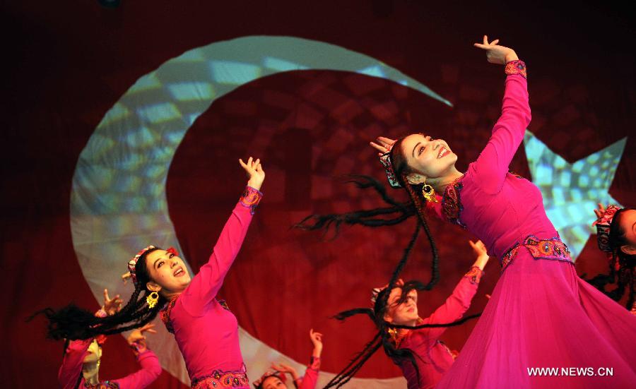 Artists perform on stage at Nevruz celebrations in Istanbul, Turkey, on March 17, 2013. The Nevruz performance, organized by the Joint Administration of Turkic Arts and Culture (TURKSOY), brings together more than 250 artists from different countries or regions to celebrate Nevruz in 15 cities of Turkey. (Xinhua/Ma Yan)