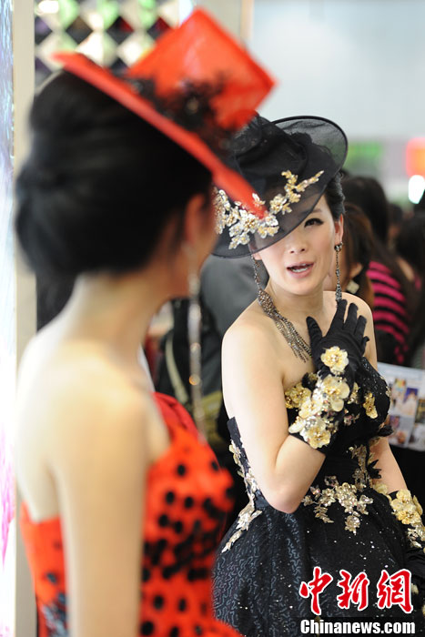 Models demonstrate wedding dresses all girls are dreaming for at the 2013 Beijing Wedding Expo for spring held in National Conference Center, March 16, 2013. The expo lasted for two days. (Photo/CNS)