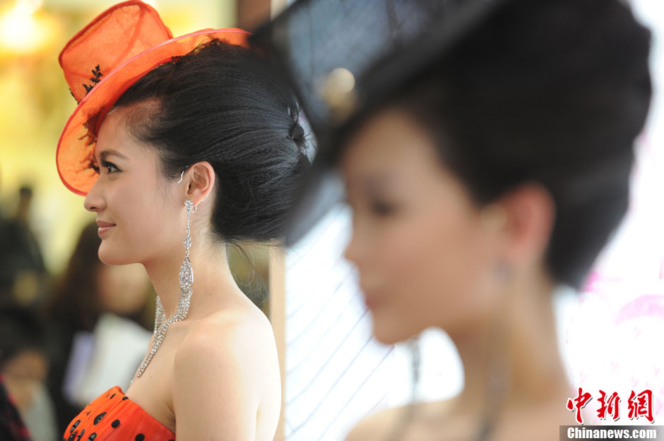 Models demonstrate wedding dresses all girls are dreaming for at the 2013 Beijing Wedding Expo for spring held in National Conference Center, March 16, 2013. The expo lasted for two days. (Photo/CNS)