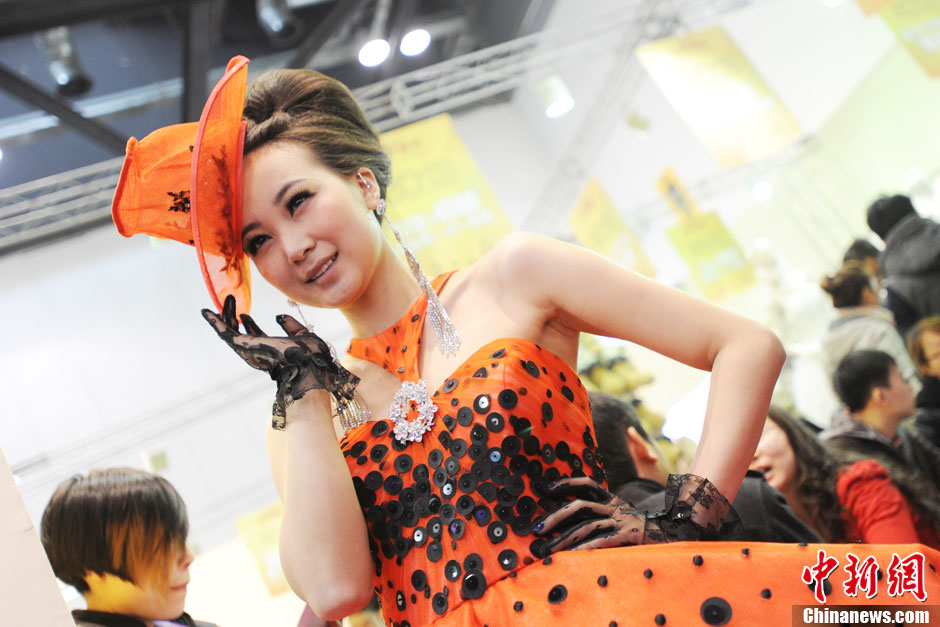 Models demonstrate wedding dresses all girls are dreaming for at the 2013 Beijing Wedding Expo for spring held in National Conference Center, March 16, 2013. The expo lasted for two days. (Photo/CNS)