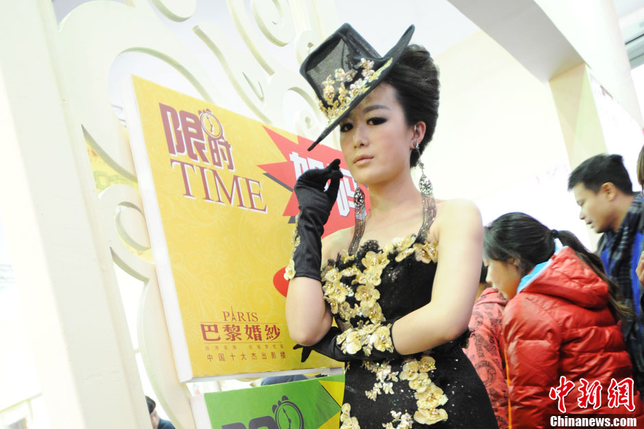 Models demonstrate wedding dresses all girls are dreaming for at the 2013 Beijing Wedding Expo for spring held in National Conference Center, March 16, 2013. The expo lasted for two days. (Photo/CNS)