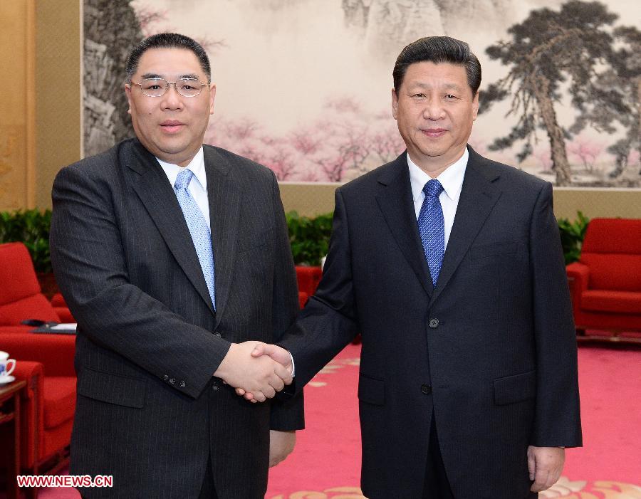 Chinese President Xi Jinping (R) meets with Chui Sai On, chief executive of Macao Special Administrative Region, in Beijing, capital of China, March 18, 2013. (Xinhua/Liu Jiansheng) 