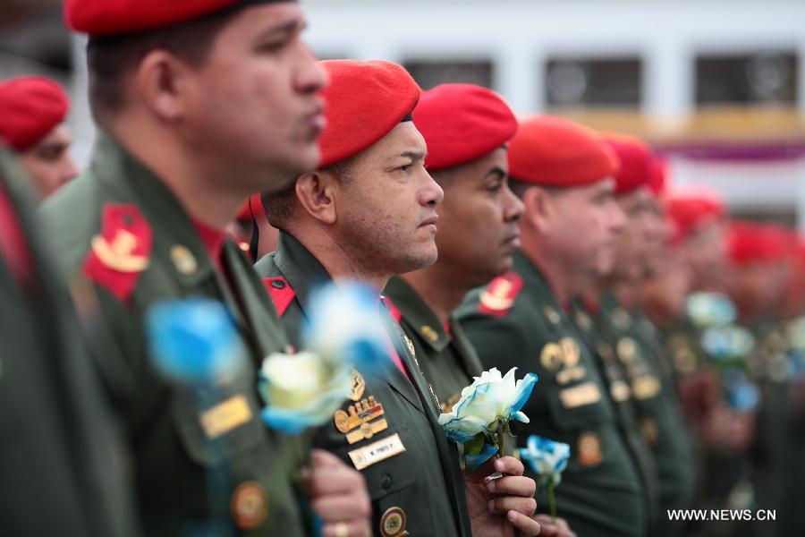 Image provided by Presidency of Venezuela shows soldiers attending a ceremony commemorating the 14 years of government of the late Venezuelan President Hugo Chavez, in Caracas, capital of Venezuela, on March 17, 2013. (Xinhua/Presidency of Venezuela) 
