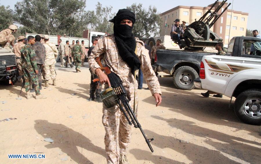 Joint Libyan forces are seen in an illegal militias base in the Libyan capital Tripoli on March 18, 2013. Joint Libyan forces from the ministries of defence and interior expelled two bases of illegal militias in the Libyan capital Tripoli. (Xinhua/Hamza Turkia)