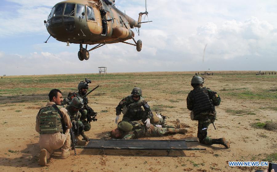 Afghan Army Commandos demonstrate their skills during a military rehearsal in Mazar-e-Sharif, Balkh province, north Afghanistan, March 16, 2013. Several hundreds of Afghan National Army (ANA) commandos participated in a one-day military exercise here on Saturday. (Xinhua/Azorda) 