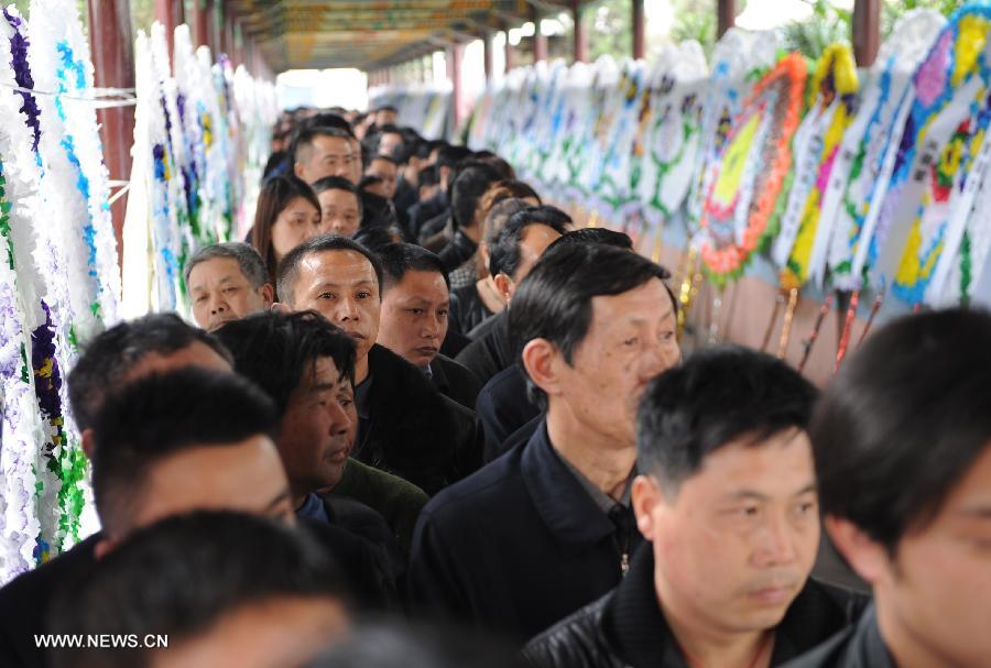 Representatives of all circles queue up to express condolence to the death of Wu Renbao, the retired Communist Party of China (CPC) chief of Huaxi Village, outside the mourning hall in Huaxi Village of Jiangyin City, east China's Jiangsu Province, March 19, 2013. Wu, 85, died of cancer on Monday at his home in the village, which is one of the richest villages in the country. Renowned as China's most eminent farmer, Wu worked hard over the past decades to lead his villagers in striving for common wealth, an ideal regarded as one of the core principles of socialism. (Xinhua/Zhang Liwei) 