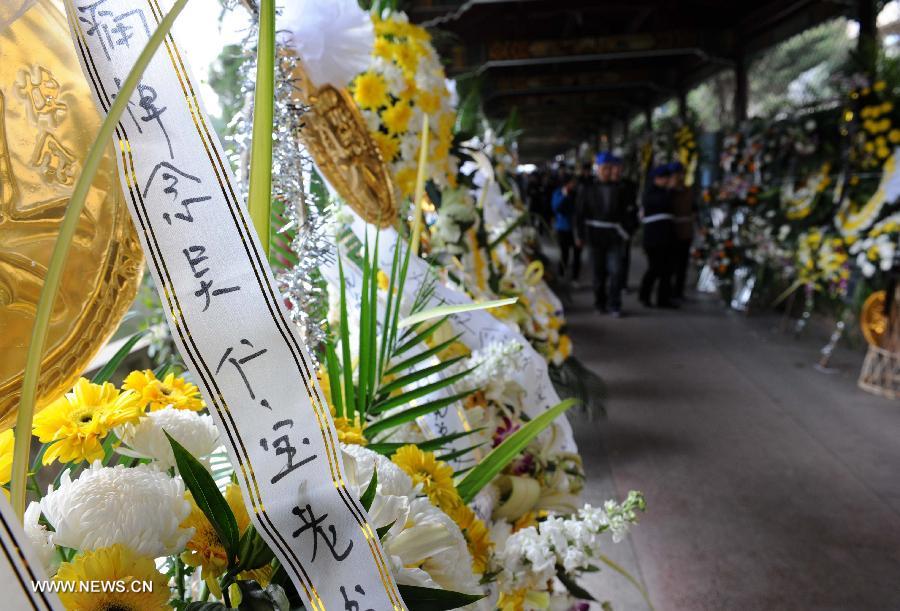 Wreaths are placed outside the mourning hall to express condolence to the death of Wu Renbao, the retired Communist Party of China (CPC) chief of Huaxi Village, in Huaxi Village of Jiangyin City, east China's Jiangsu Province, March 19, 2013. Wu, 85, died of cancer on Monday at his home in the village, which is one of the richest villages in the country. Renowned as China's most eminent farmer, Wu worked hard over the past decades to lead his villagers in striving for common wealth, an ideal regarded as one of the core principles of socialism. (Xinhua/Sun Can)