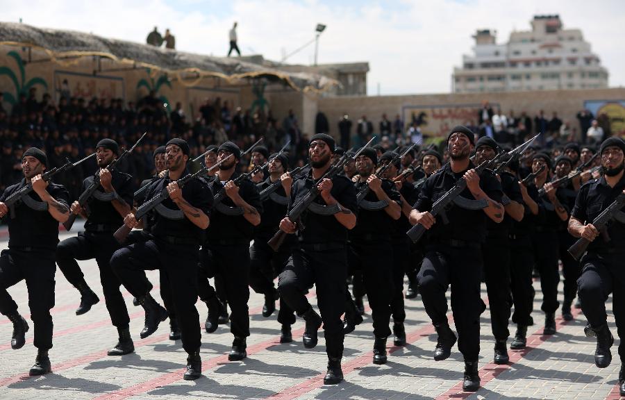 Palestinian police officers show their skills during their graduation ceremony at the police academy in Gaza City, on March 19, 2013. (Xinhua/Wissam Nassar)