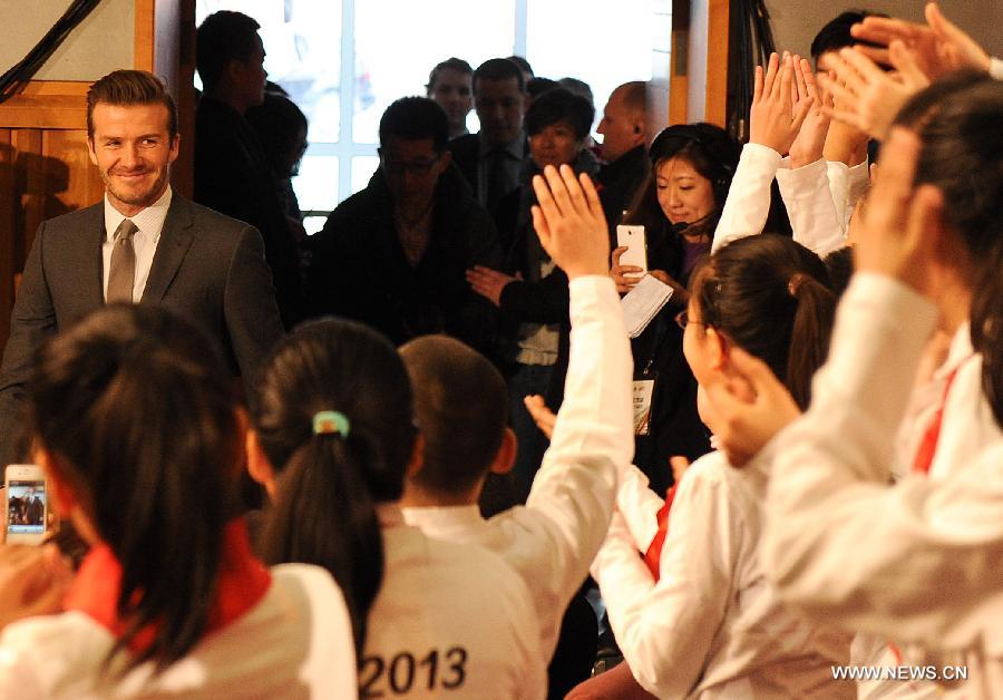 British footballer David Beckham (L) arrives at a press conference in Beijing, capital of China, on March 20, 2013. David Beckham came to China as the ambassador for the youth football program in China and the Chinese Super League (CSL). (Xinhua/Cao Can)